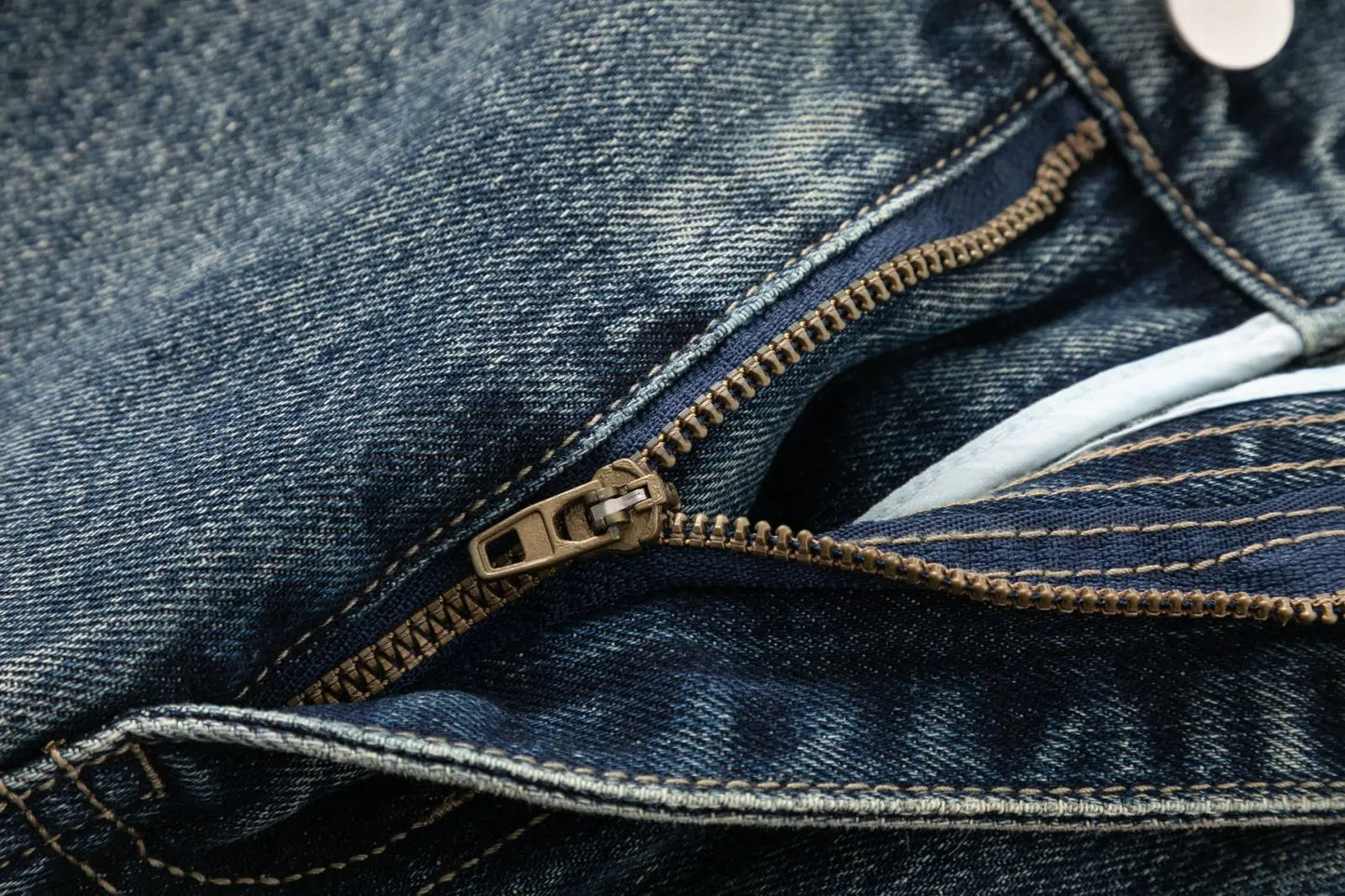 Men's jeans are cut to accommodate various leg shapes, with classic back pocket design and a loose fit.
