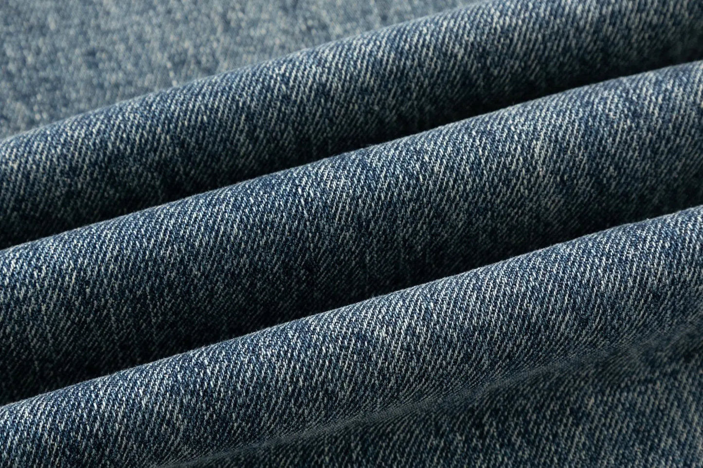 Men's jeans are cut to accommodate various leg shapes, with classic back pocket design and a loose fit.