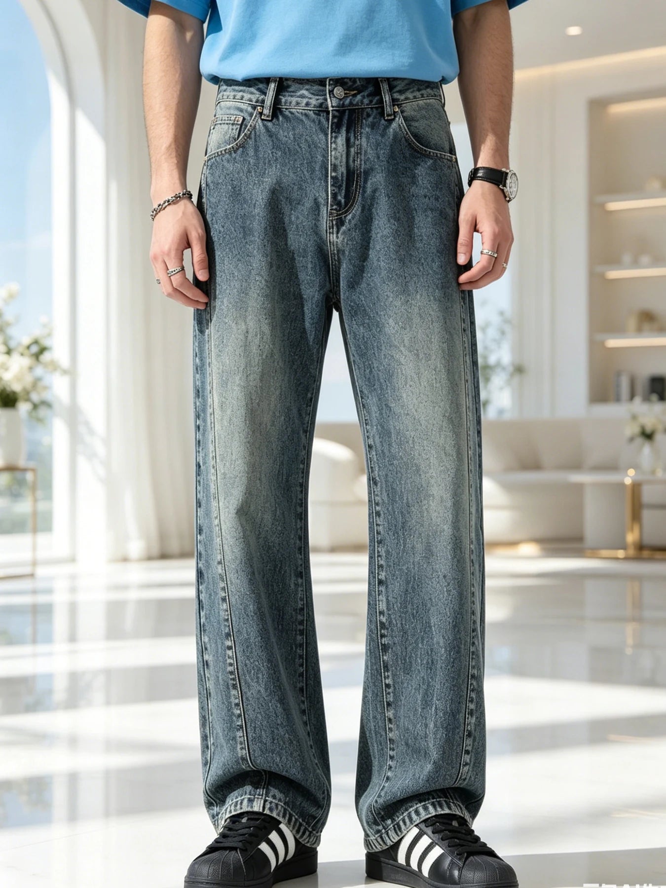 Men's jeans are cut to accommodate various leg shapes, with classic back pocket design and a loose fit.